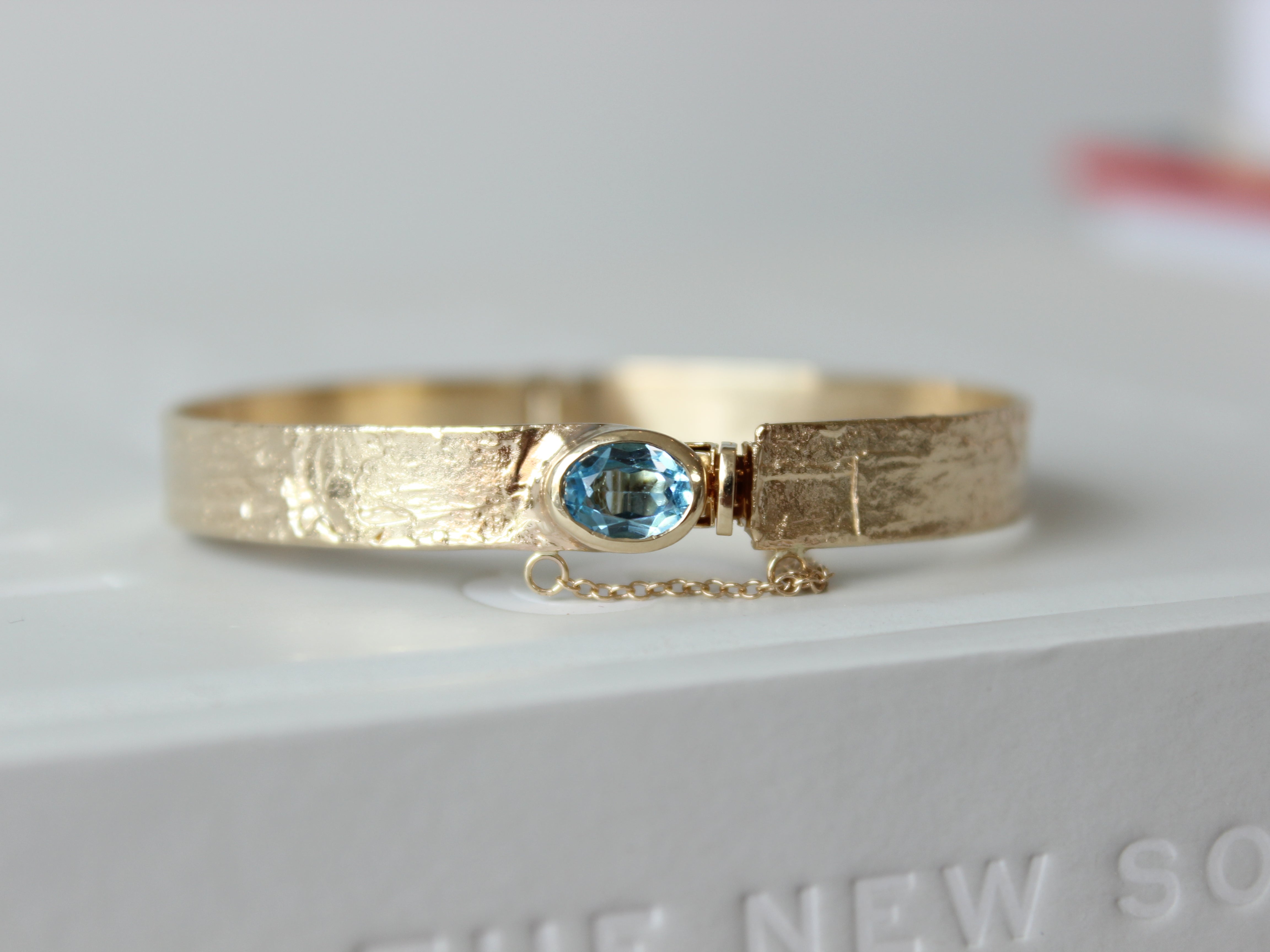 Gammon Ruth Birthday Topaz Bangle 20255.JPG