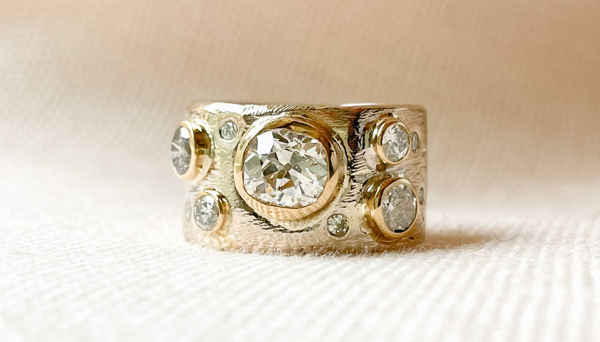 Custom 14k gold scatter cigar band ring with heirloom diamonds